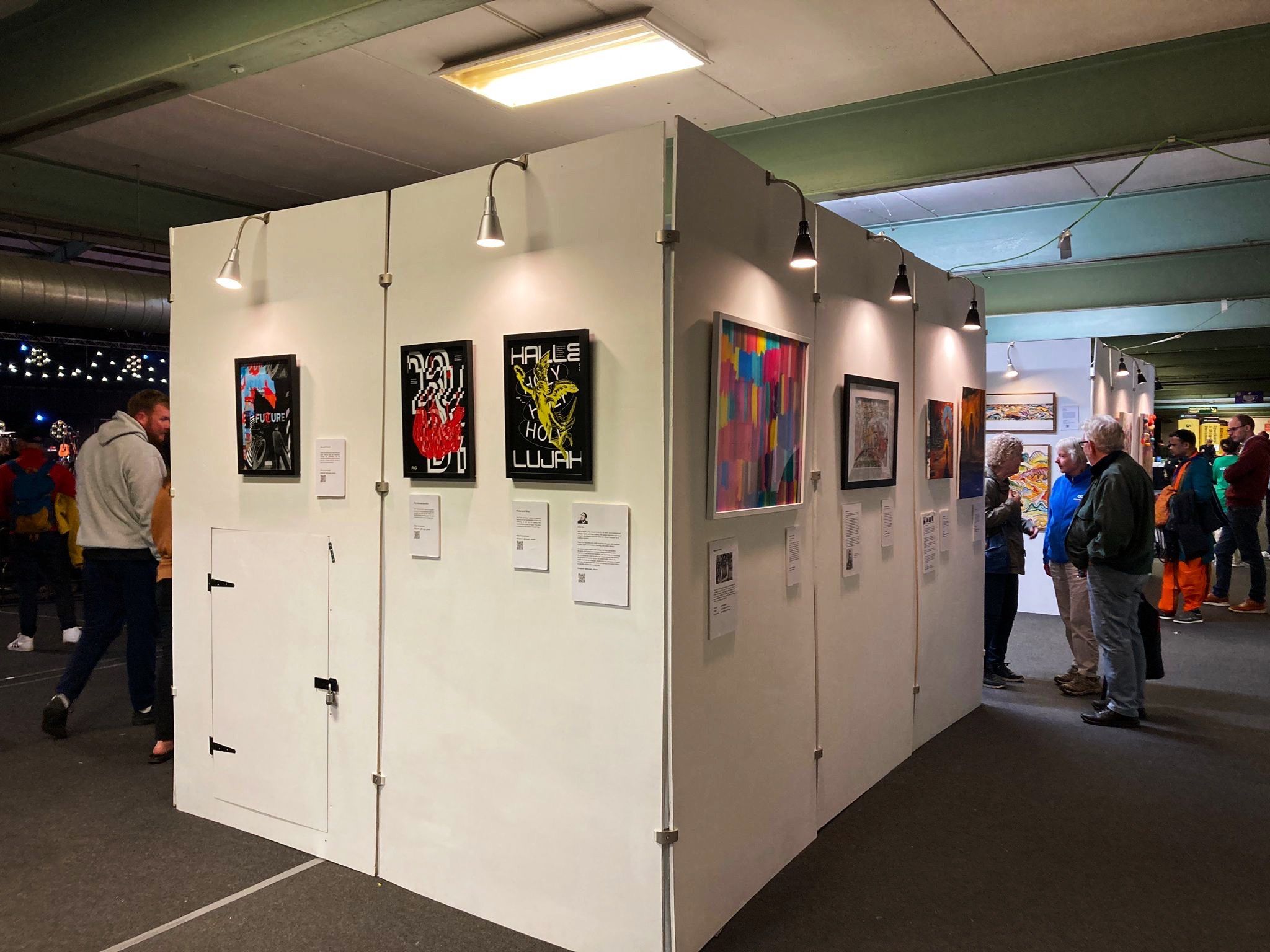 A wide view of the art exhibition and its visitors